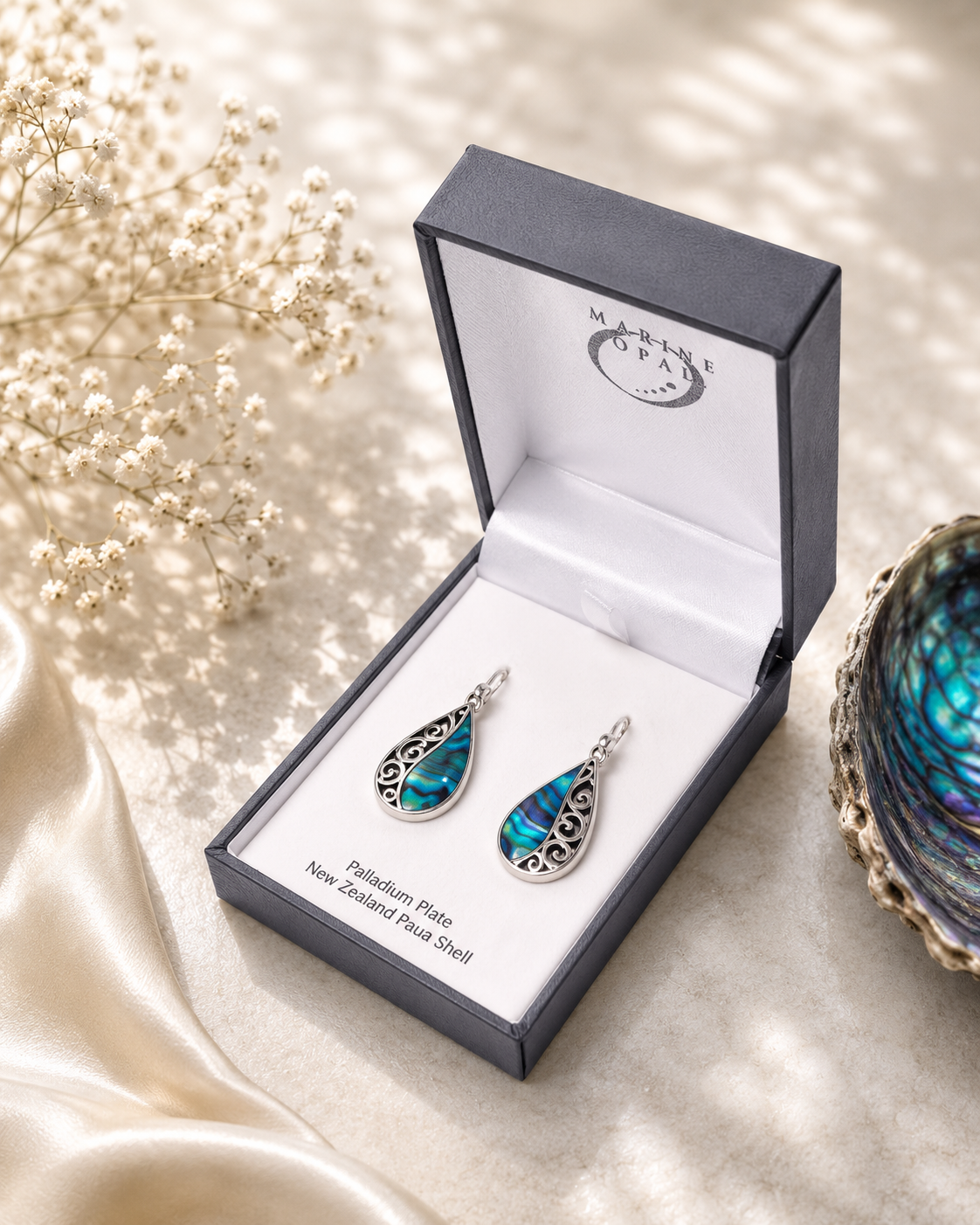 Paua Shell Earrings with Spiral design.